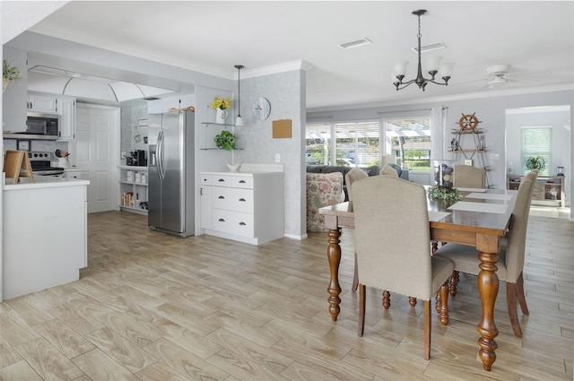 dining area with plenty of natural light, visible vents, and crown molding