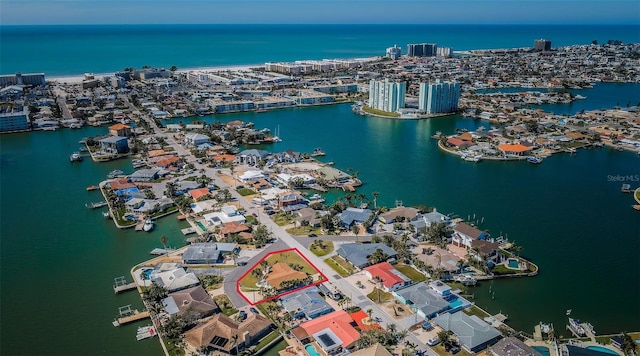 birds eye view of property featuring a view of city and a water view