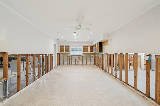 interior space with a ceiling fan, recessed lighting, and speckled floor