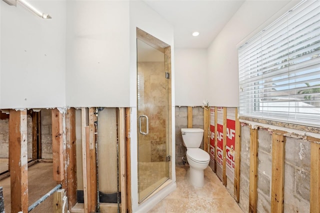 full bathroom with toilet and a stall shower
