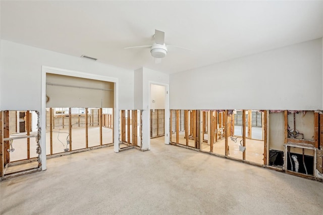 spare room featuring a ceiling fan and visible vents