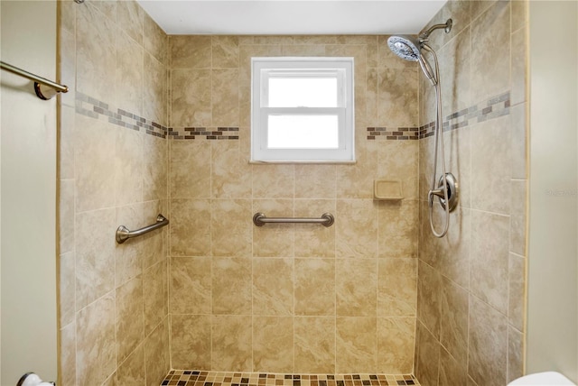 full bath with tiled shower