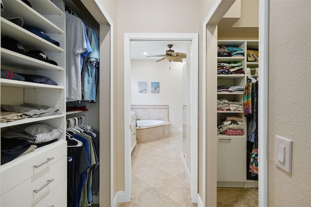 spacious closet featuring light tile patterned floors and a ceiling fan