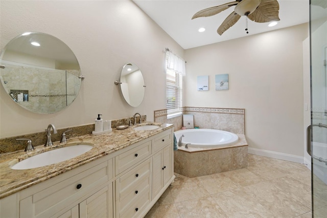 full bath with a sink, a garden tub, and a stall shower