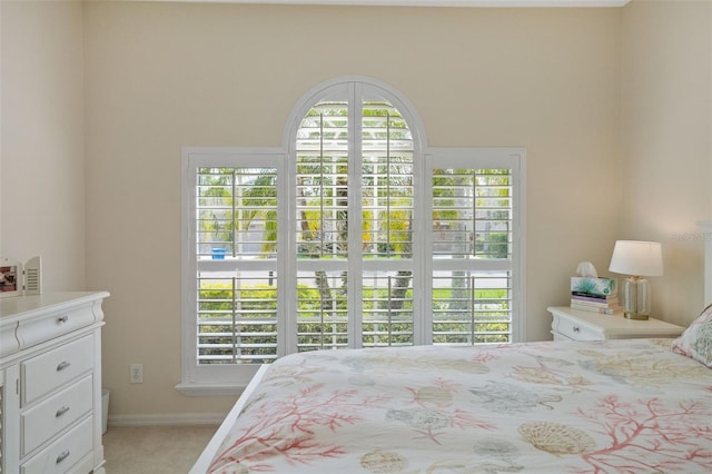 carpeted bedroom with baseboards