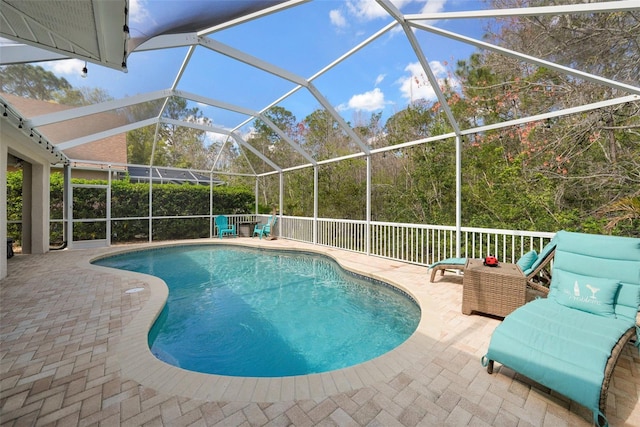 view of pool featuring a fenced in pool, a lanai, and a patio area