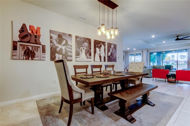 tiled dining room featuring recessed lighting, ceiling fan with notable chandelier, visible vents, and baseboards