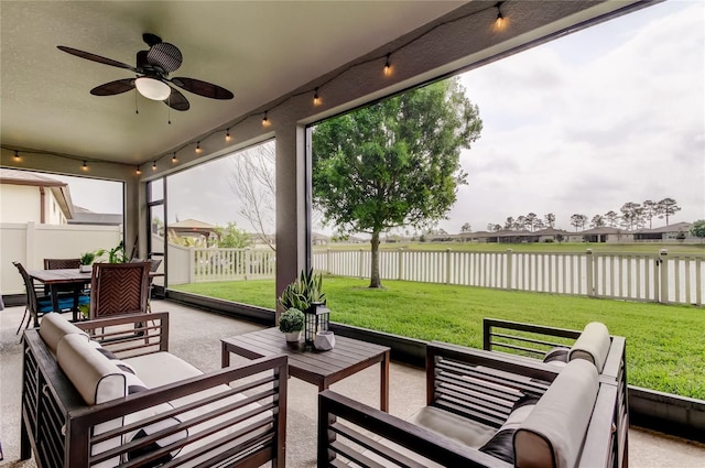 view of patio / terrace with an outdoor living space, outdoor dining area, a fenced backyard, ceiling fan, and a water view