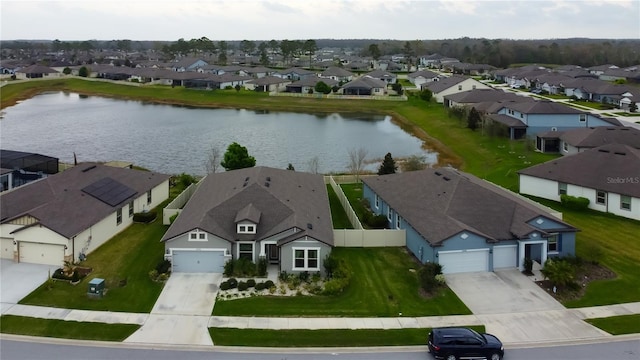 aerial view with a residential view and a water view