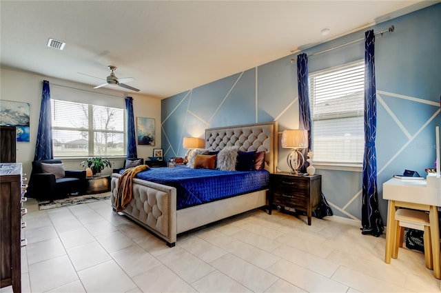 bedroom featuring a ceiling fan and visible vents