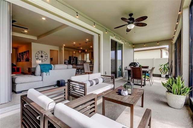 view of patio / terrace featuring visible vents, ceiling fan, fence, outdoor lounge area, and outdoor dining area