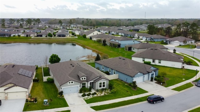 birds eye view of property with a residential view and a water view