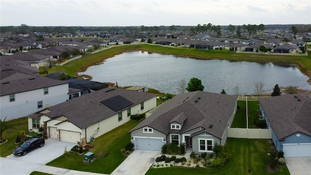 birds eye view of property featuring a residential view and a water view