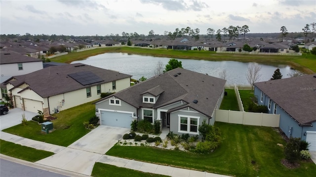 aerial view with a residential view and a water view