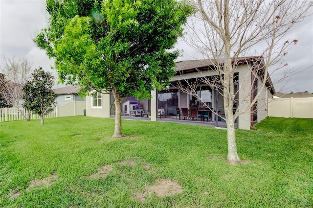 view of yard with a patio area and a fenced backyard