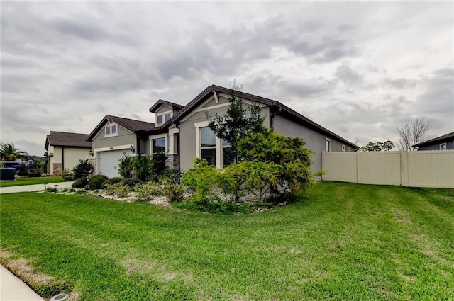 view of property exterior featuring a yard, stucco siding, a garage, and fence