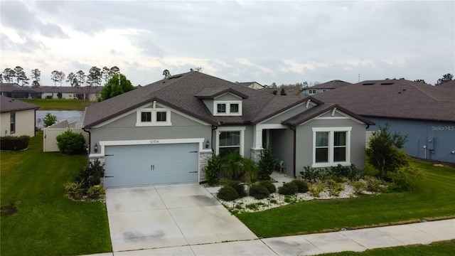 view of front facade featuring stucco siding, driveway, a residential view, a front yard, and an attached garage