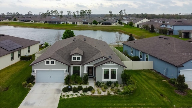 bird's eye view with a residential view and a water view