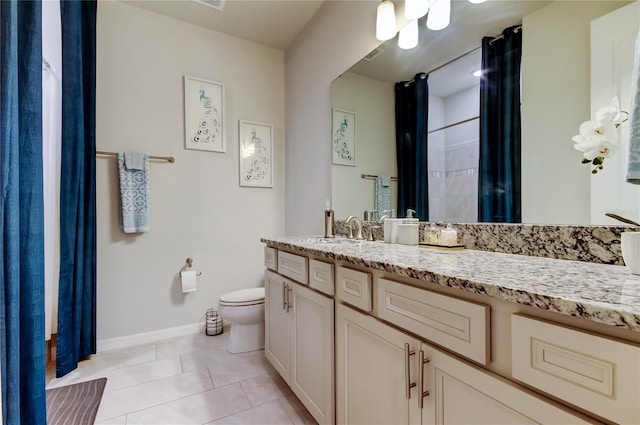 full bathroom with tile patterned floors, baseboards, toilet, and vanity