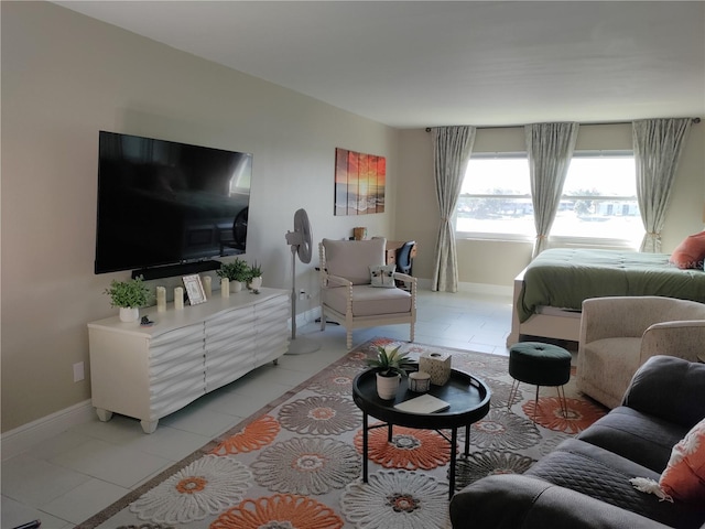 living room with light tile patterned floors and baseboards