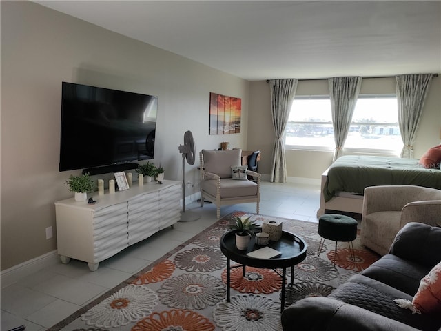 living room featuring light tile patterned flooring and baseboards