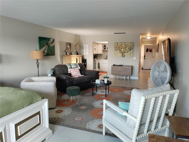 living area featuring light tile patterned floors