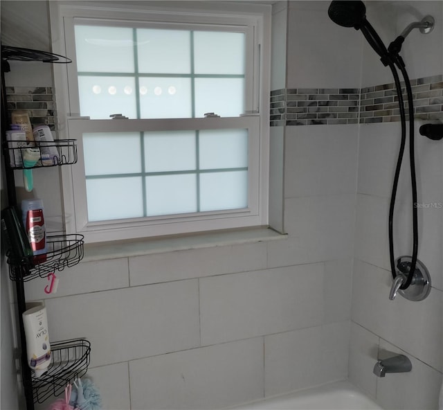 full bathroom featuring a wealth of natural light and tub / shower combination