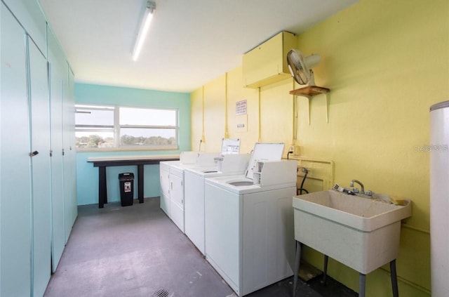 common laundry area with a sink and washer and dryer