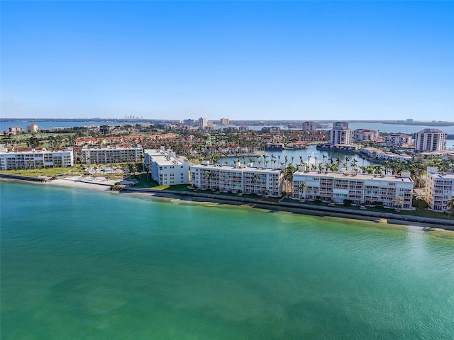 drone / aerial view featuring a water view and a city view