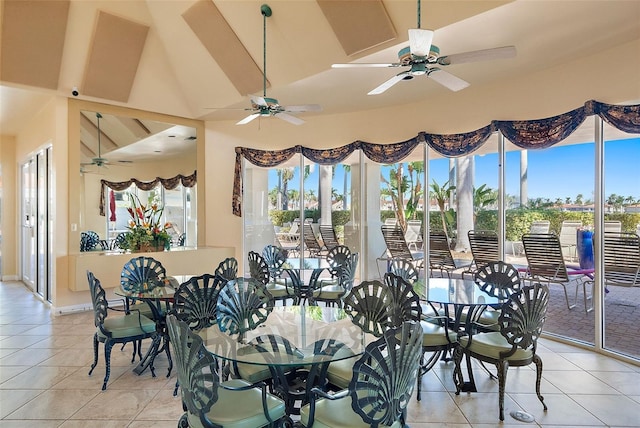 dining area featuring a ceiling fan, a wealth of natural light, and light tile patterned flooring