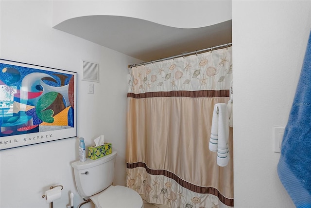 bathroom with a shower with curtain, visible vents, and toilet