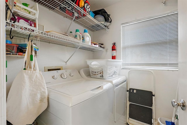 washroom featuring laundry area and independent washer and dryer