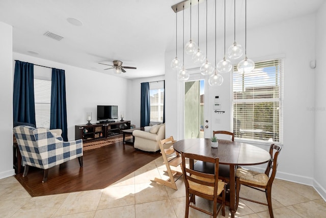6157 Castleton Hollow Rd, Riverview, FL 33578 - dining room with light tile patterned floors, ceiling fan, and baseboards