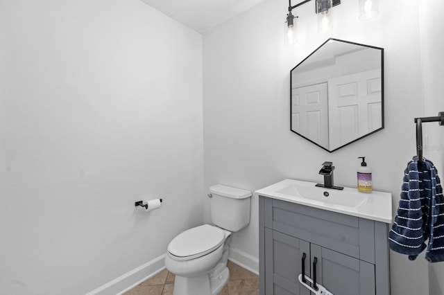 6157 Castleton Hollow Rd, Riverview, FL 33578 - half bathroom with baseboards, vanity, tile patterned flooring, and toilet