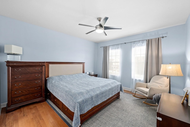 6157 Castleton Hollow Rd, Riverview, FL 33578 - bedroom with light wood-style floors and ceiling fan