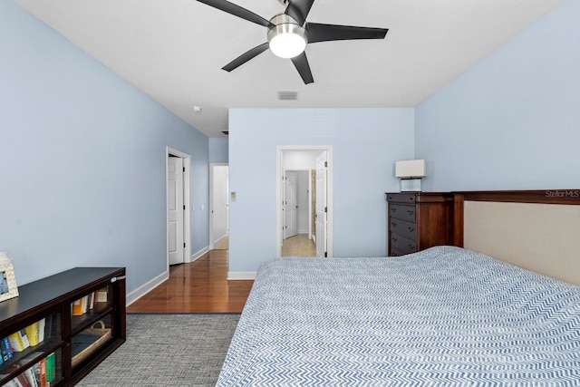 6157 Castleton Hollow Rd, Riverview, FL 33578 - carpeted bedroom with wood finished floors, baseboards, and ceiling fan