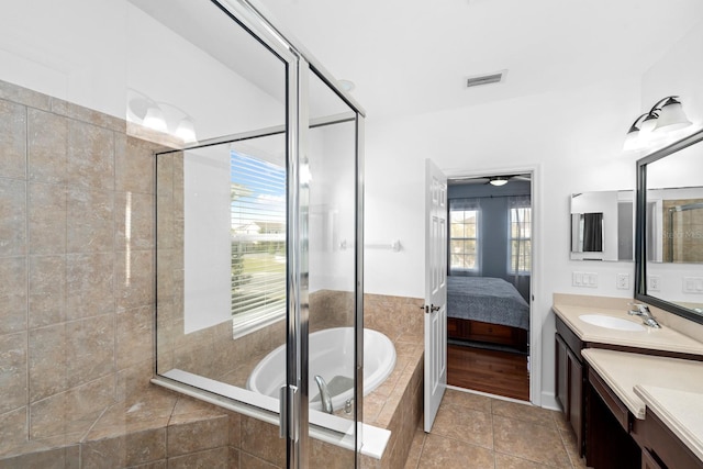 6157 Castleton Hollow Rd, Riverview, FL 33578 - full bath with a stall shower, connected bathroom, vanity, and a bath