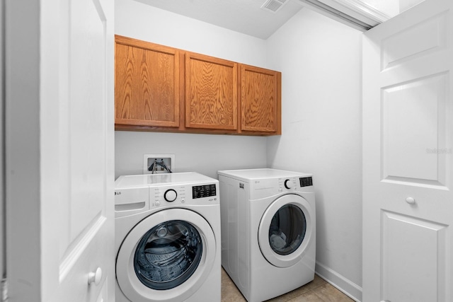 6157 Castleton Hollow Rd, Riverview, FL 33578 - washroom featuring independent washer and dryer, cabinet space, and light tile patterned floors