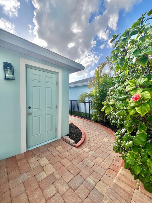 6157 Castleton Hollow Rd, Riverview, FL 33578 - view of exterior entry featuring stucco siding