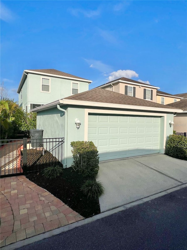 6157 Castleton Hollow Rd, Riverview, FL 33578 - view of front facade featuring stucco siding, driveway, and an attached garage