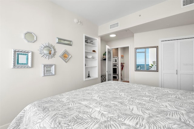 bedroom featuring visible vents and a closet