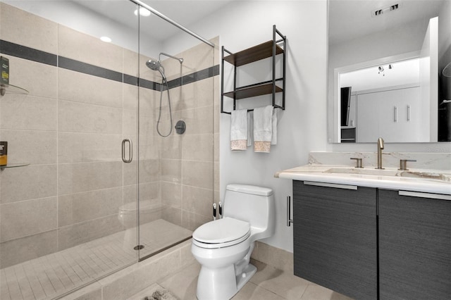 full bath with visible vents, toilet, a shower stall, vanity, and tile patterned floors