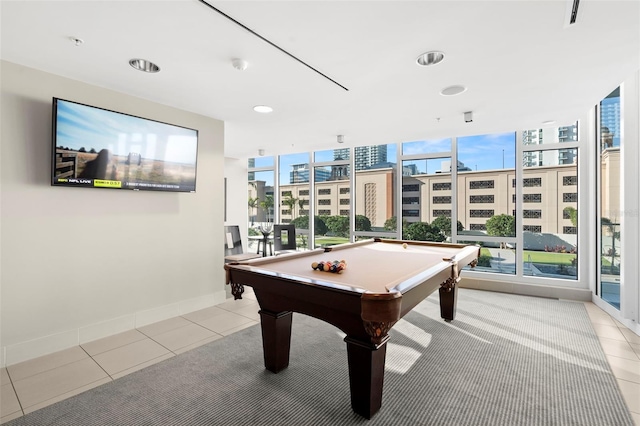 recreation room with light tile patterned floors, floor to ceiling windows, baseboards, and pool table