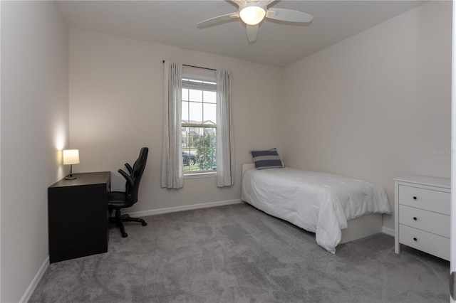 bedroom featuring a ceiling fan, light colored carpet, and baseboards