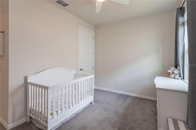 bedroom featuring baseboards, visible vents, dark colored carpet, and a ceiling fan