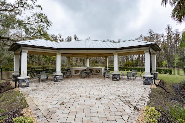 surrounding community featuring a patio area, fence, and a gazebo