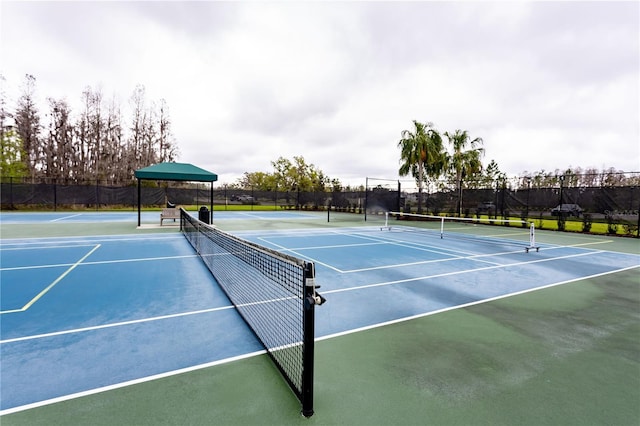 view of tennis court with fence