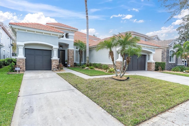 mediterranean / spanish-style house with a garage, concrete driveway, a front yard, and stucco siding