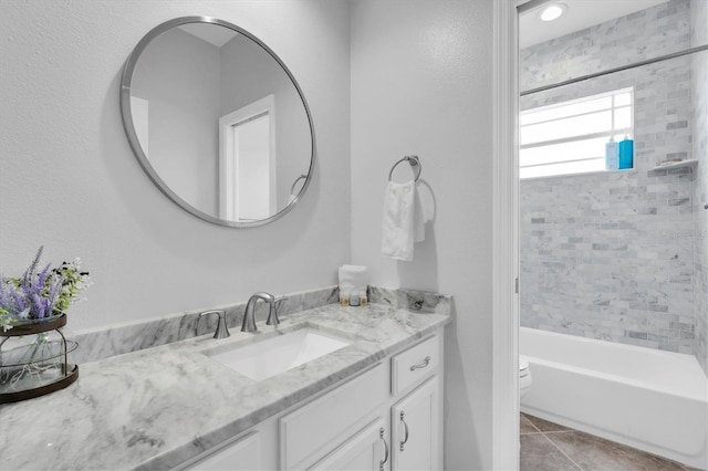 full bath with toilet, shower / bath combination, vanity, and tile patterned floors