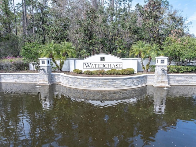 community sign with a water view